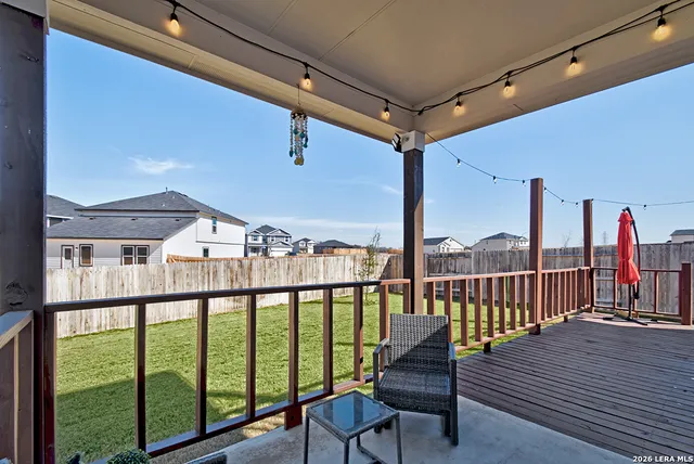 a view of a balcony with chairs
