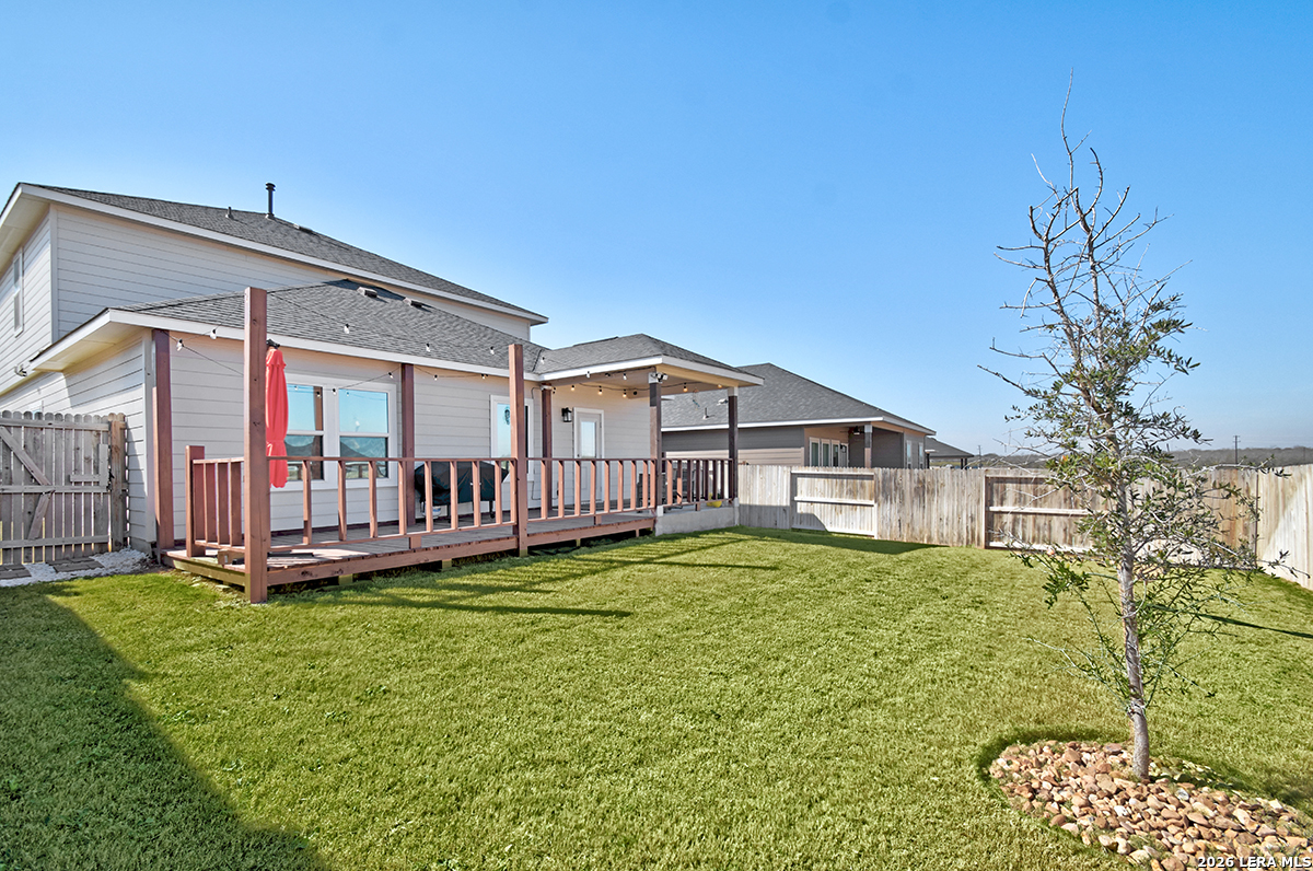 8863 Grey Elm Elmendorf, TX 78112 - Photo 32 of 35 a house view with a garden space