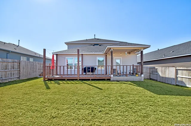 a view of a house with swimming pool and a yard