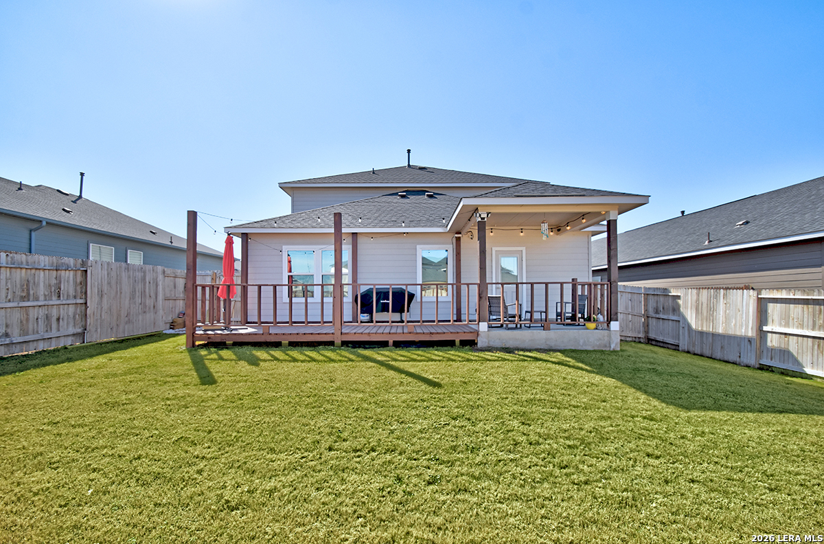 8863 Grey Elm Elmendorf, TX 78112 - Photo 33 of 35 a view of a house with swimming pool and a yard
