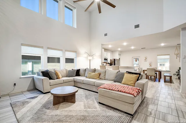 a living room with furniture and a large window