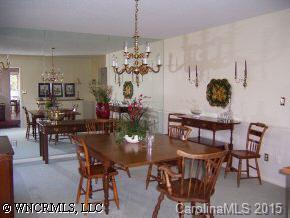 40 Hunting Country Trail Tryon, NC 28782 - Photo 2 of 9 a view of a dining room with furniture and chandelier