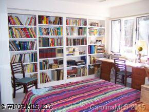 40 Hunting Country Trail Tryon, NC 28782 - Photo 4 of 9 a bed room with a bed and a book shelf
