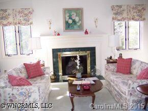 40 Hunting Country Trail Tryon, NC 28782 - Photo 7 of 9 a living room with furniture a large window and a fireplace