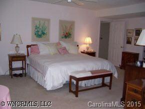 40 Hunting Country Trail Tryon, NC 28782 - Photo 8 of 9 a bed room with a bed and a lamp