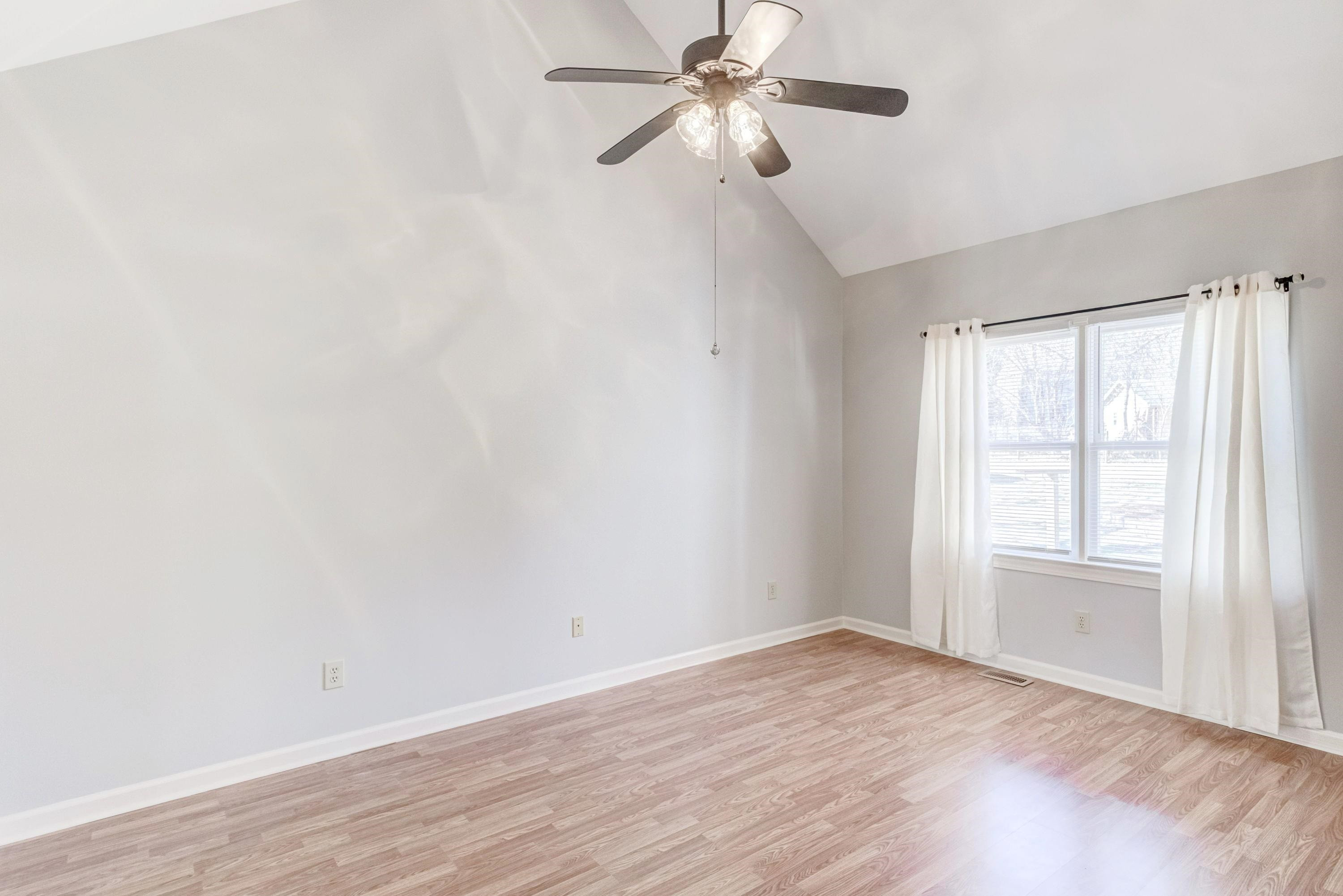 9305 Tallgrass Road Raleigh, NC 27603 - Photo 16 of 49 Enjoy the spaciousness of this owners suite with cathedral ceiling, updated lighting, double windows (wood windows were replaced with vinyl windows) Owners Suite