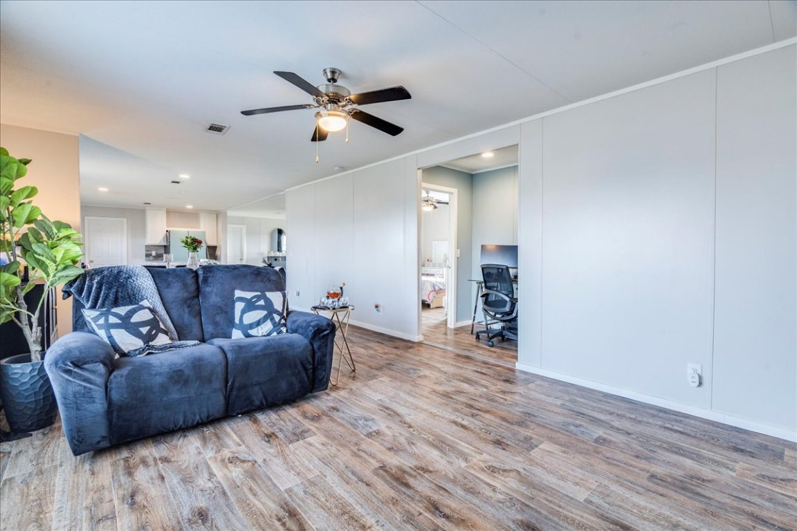 114 Gran Cielo Elgin, TX 78621 - Photo 10 of 40 a living room with furniture and a wooden floor