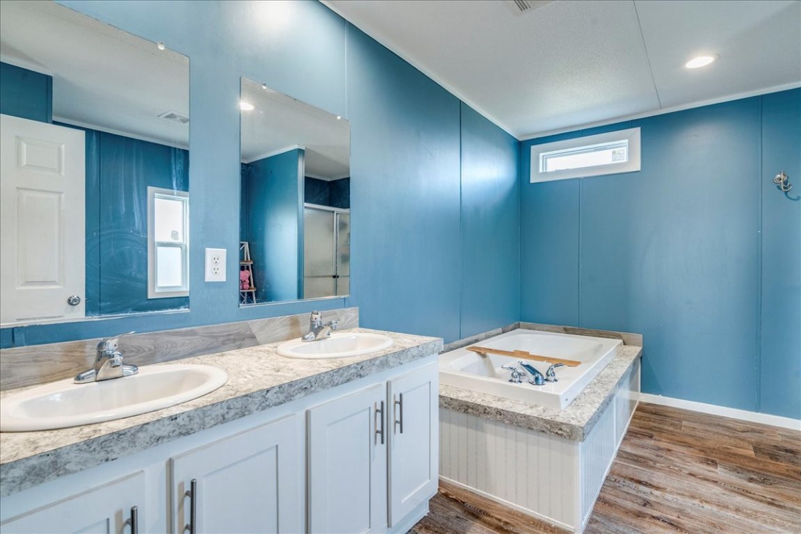 114 Gran Cielo Elgin, TX 78621 - Photo 12 of 40 a bathroom with a sink and a mirror