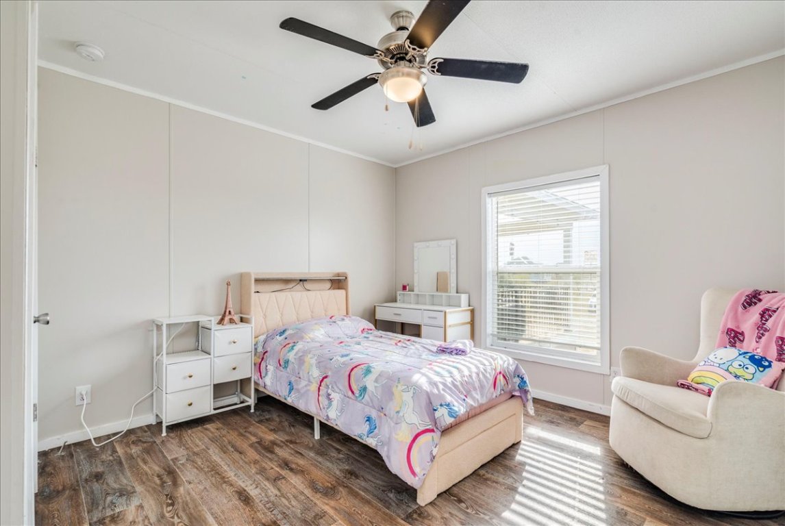 114 Gran Cielo Elgin, TX 78621 - Photo 14 of 40 a bedroom with a bed and a window