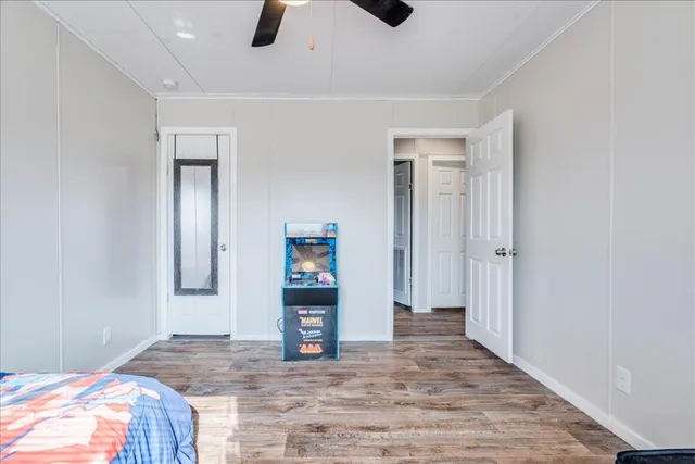 a bathroom with a granite countertop sink a toilet and a shower