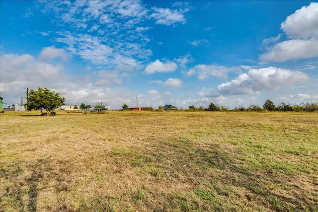 a front view of house with yard slide and outdoor seating