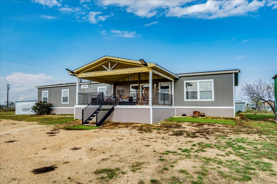 114 Gran Cielo Elgin, TX 78621 - Photo 37 of 40 a front view of a house with a yard
