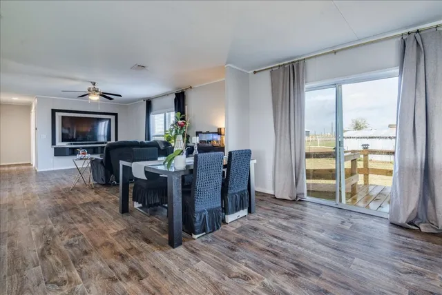 a large kitchen with kitchen island a sink a counter space and stainless steel appliances