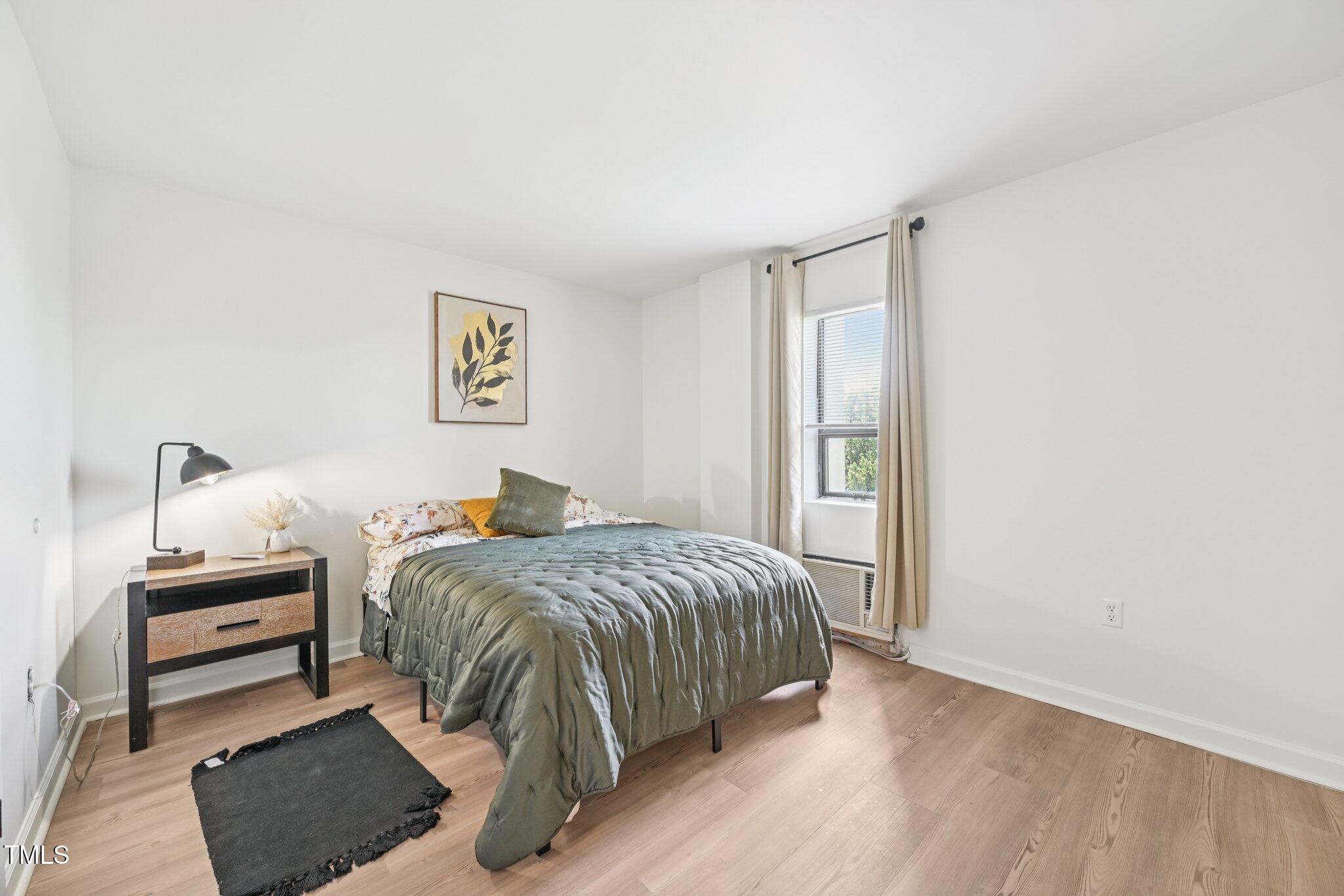 4700 Westgrove Street, Unit 721 Raleigh, NC 27606 - Photo 16 of 21 a bed room with a bed and a window