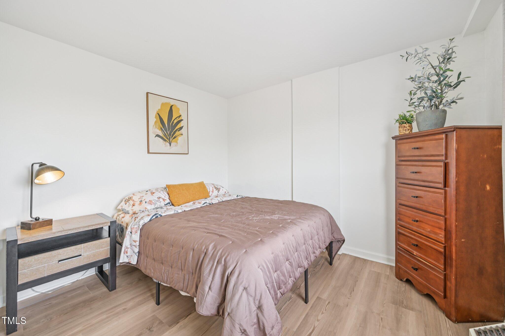 4700 Westgrove Street, Unit 721 Raleigh, NC 27606 - Photo 20 of 21 a bedroom with a bed and a closet