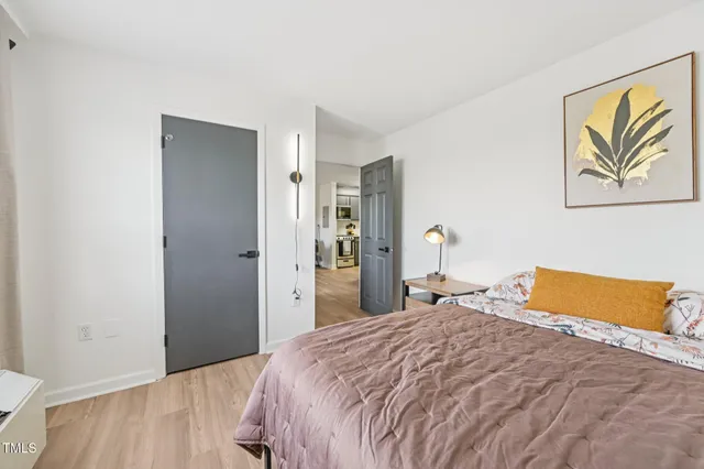 a bedroom with a bed and a couch