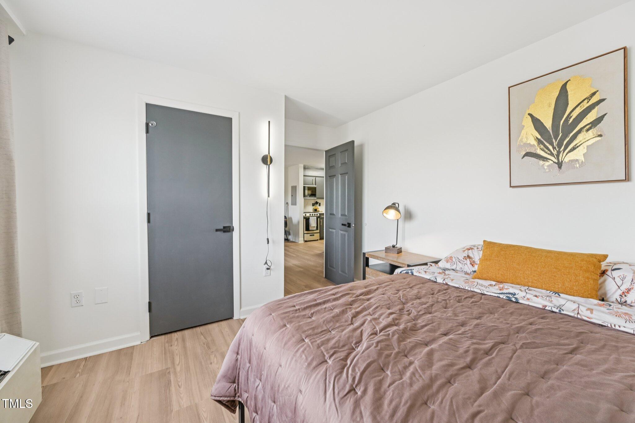 4700 Westgrove Street, Unit 721 Raleigh, NC 27606 - Photo 21 of 21 a bedroom with a bed and a couch