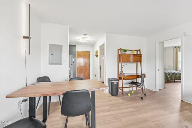a view of a dining room with furniture and wooden floor