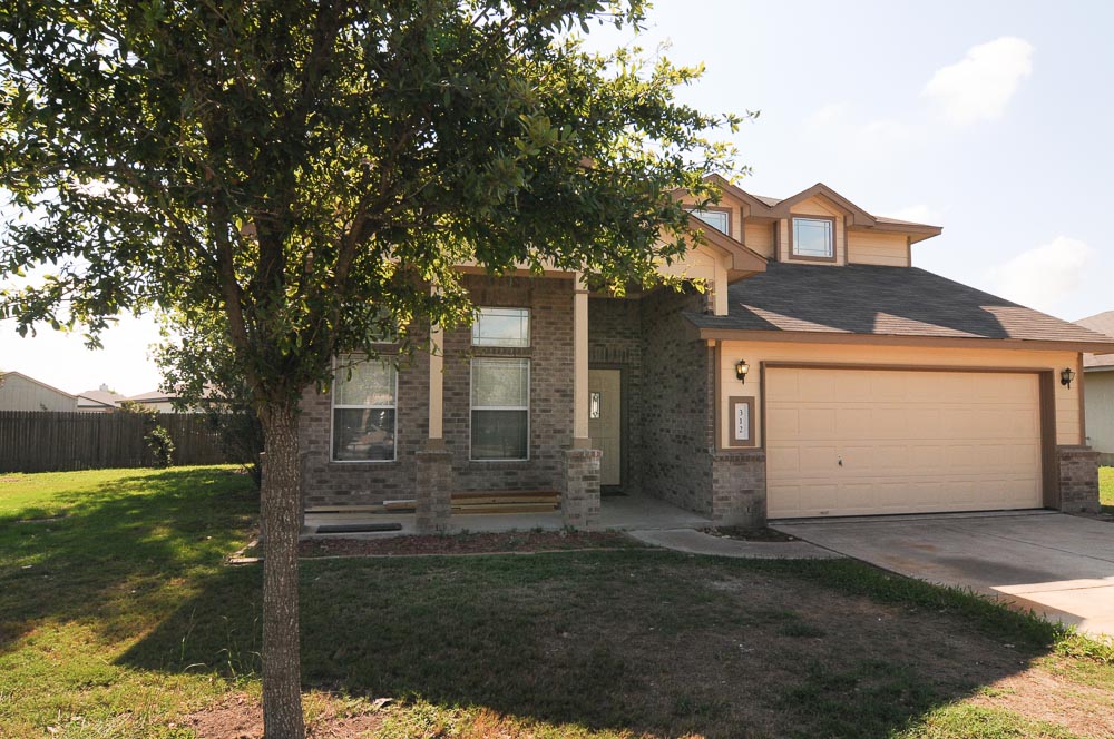 312 Spring Branch Loop Kyle, TX 78640 - Photo 1 of 1 a front view of house with yard