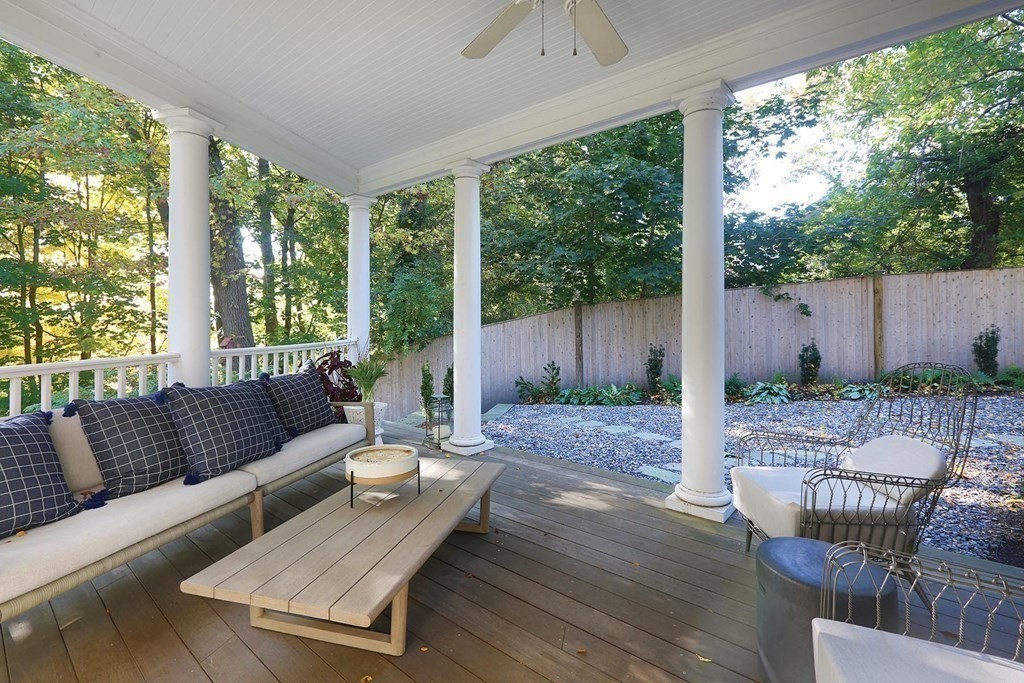 16 Pilgrim Road Newton, MA 02468 - Photo 11 of 25 a view of a patio with couches chairs and wooden floor