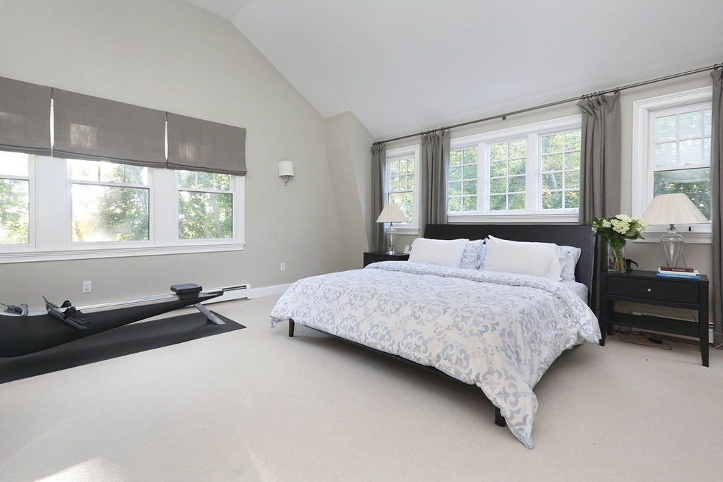 16 Pilgrim Road Newton, MA 02468 - Photo 13 of 25 a bedroom with a bed and wooden floor