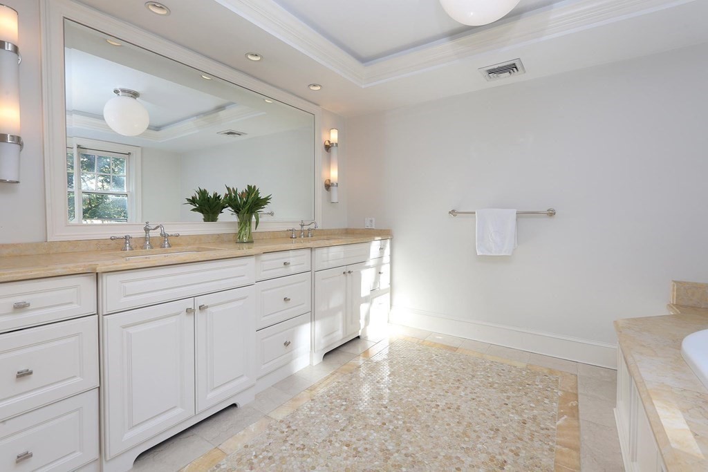 16 Pilgrim Road Newton, MA 02468 - Photo 14 of 25 a spacious bathroom with a sink and a mirror