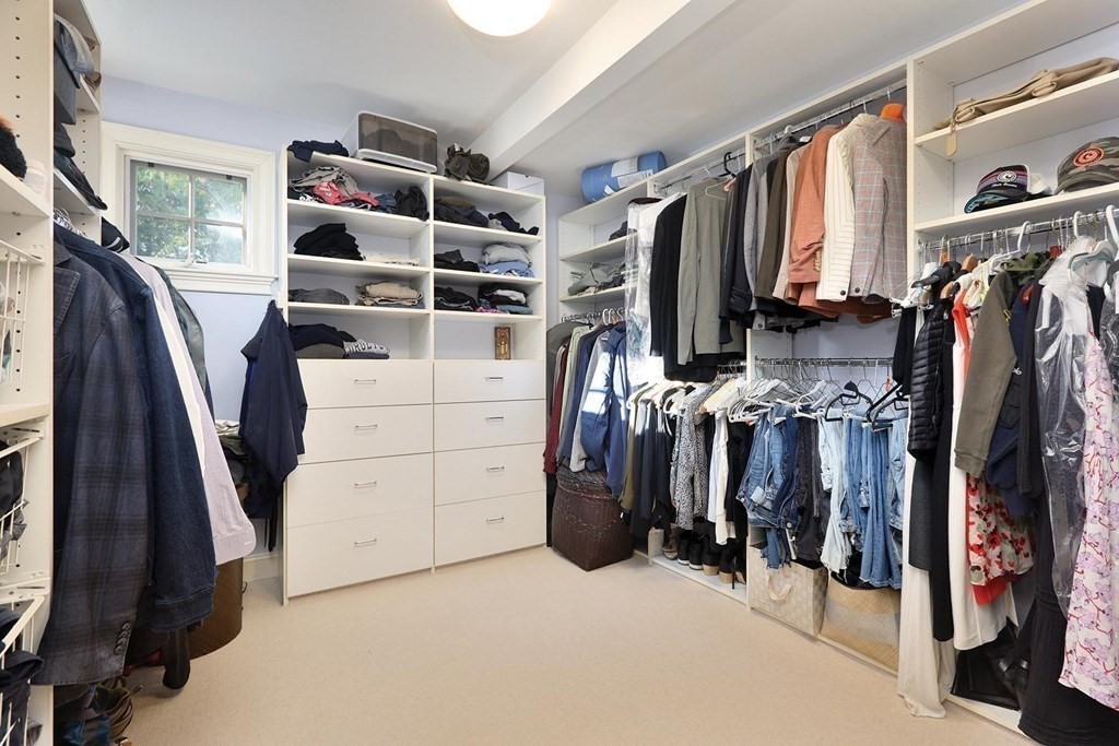 16 Pilgrim Road Newton, MA 02468 - Photo 15 of 25 a view of walk in closet with clothes and shoes
