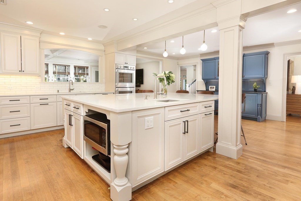 16 Pilgrim Road Newton, MA 02468 - Photo 3 of 25 a kitchen that has a lot of white cabinets and wooden floor