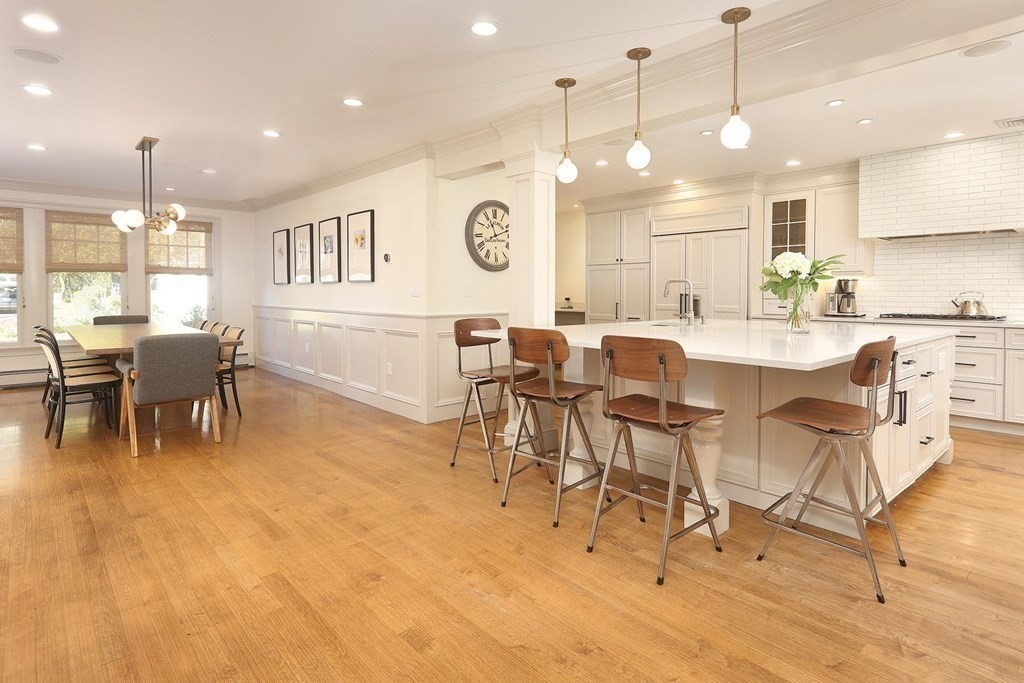 16 Pilgrim Road Newton, MA 02468 - Photo 4 of 25 a large kitchen with a table and chairs