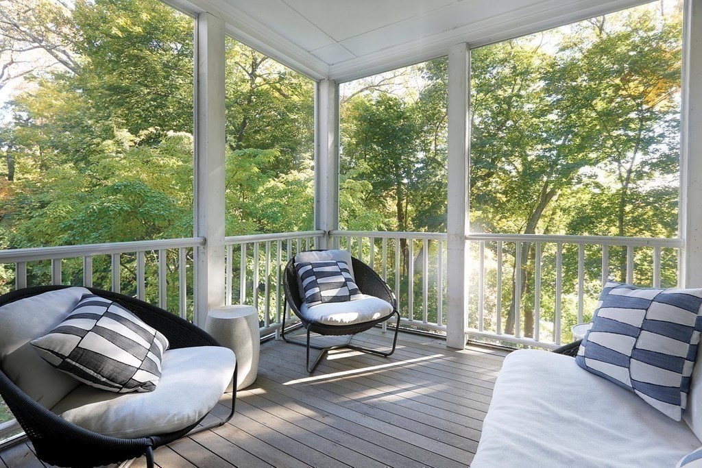 16 Pilgrim Road Newton, MA 02468 - Photo 6 of 25 a balcony with wooden floor and outdoor seating
