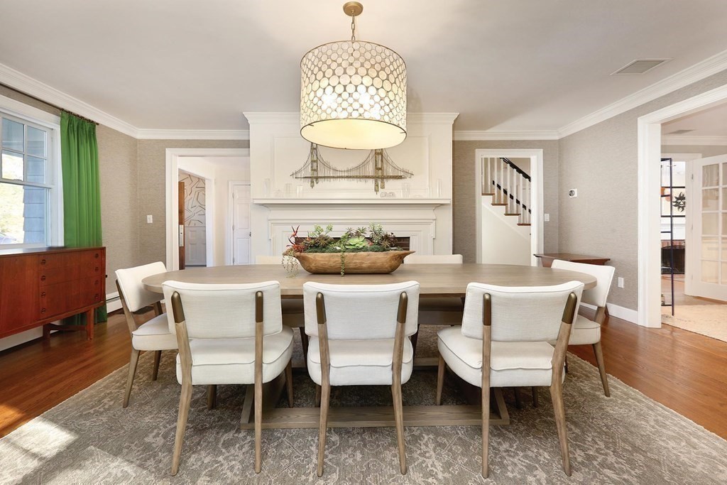 16 Pilgrim Road Newton, MA 02468 - Photo 7 of 25 a dining room with furniture a rug and wooden floor