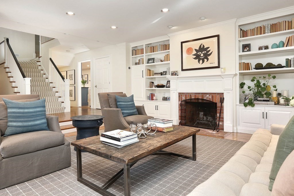 16 Pilgrim Road Newton, MA 02468 - Photo 8 of 25 a living room with furniture and a fireplace