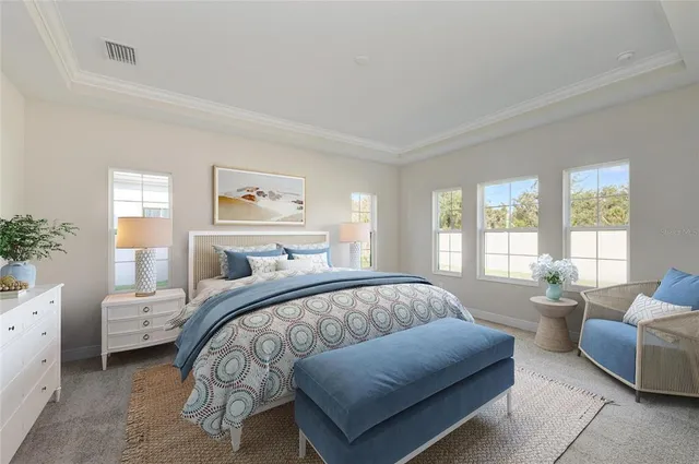 a bedroom with a bed and a couch with window