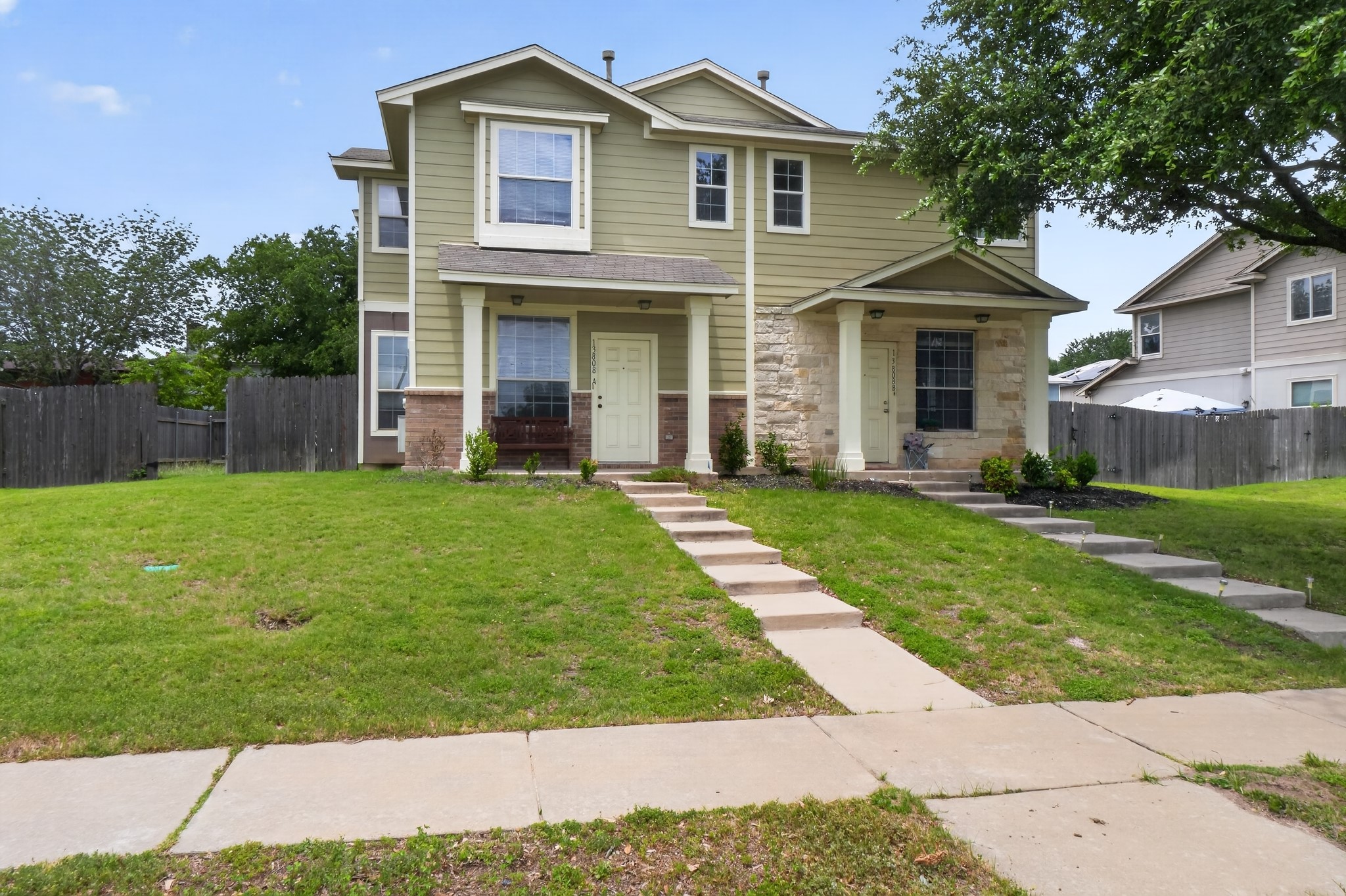 13808 Harris Ridge Boulevard Pflugerville, TX 78660 - Photo 2 of 40 a front view of a house with a yard
