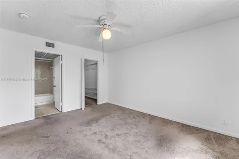 an empty room with fan