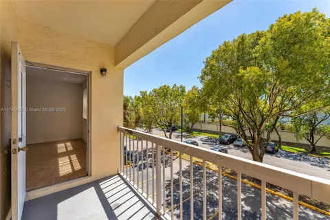 a view of a balcony with wooden fence