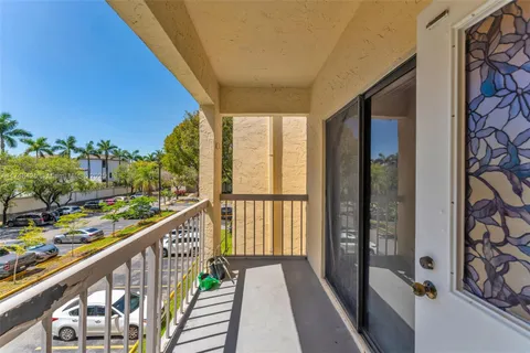 a view of a balcony with furniture