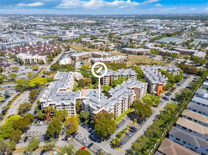 an aerial view of residential building and parking space