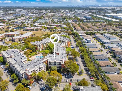 an aerial view of residential houses with outdoor space