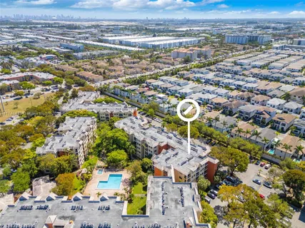an aerial view of residential houses with outdoor space