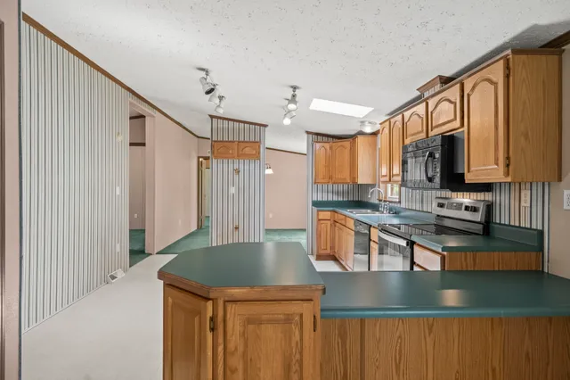 a view of a field with an trees