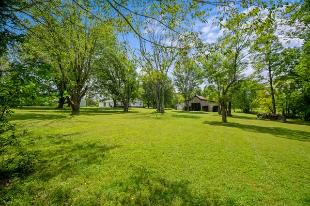 a kitchen with stainless steel appliances granite countertop a refrigerator and a stove