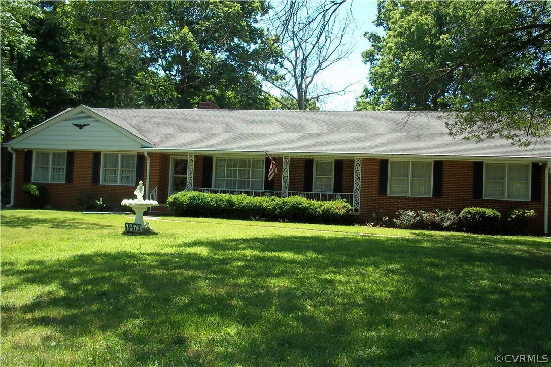19613 Genito Road Moseley, VA 23120 - Photo 1 of 22 a front view of a house with a yard and porch