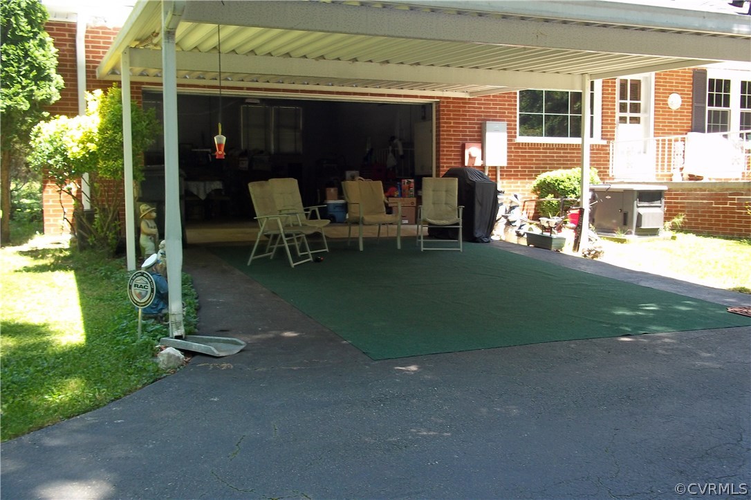 19613 Genito Road Moseley, VA 23120 - Photo 15 of 22 a view of backyard of the house and outdoor seating