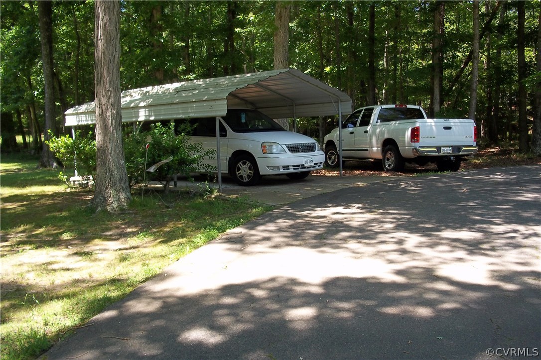 19613 Genito Road Moseley, VA 23120 - Photo 16 of 22 a car parked in front of white house