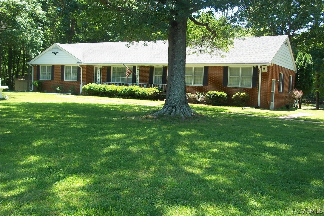 19613 Genito Road Moseley, VA 23120 - Photo 2 of 22 a view of house with a big yard and potted plants