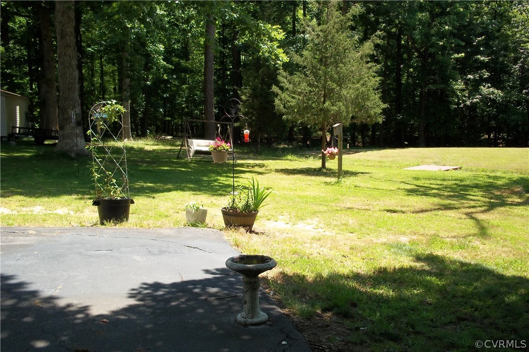 19613 Genito Road Moseley, VA 23120 - Photo 22 of 22 a swimming pool with outdoor seating and yard