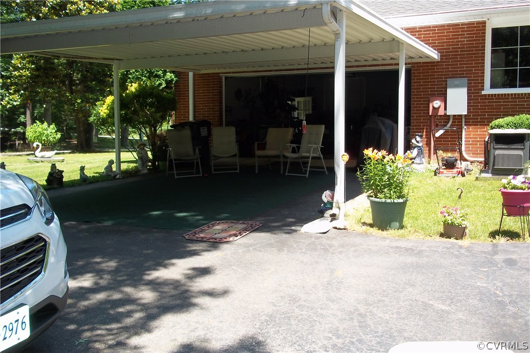 19613 Genito Road Moseley, VA 23120 - Photo 5 of 22 a view of a house with backyard porch and sitting area