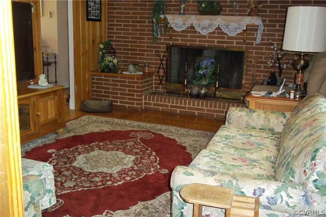 19613 Genito Road Moseley, VA 23120 - Photo 10 of 22 a view of a fireplace with furniture