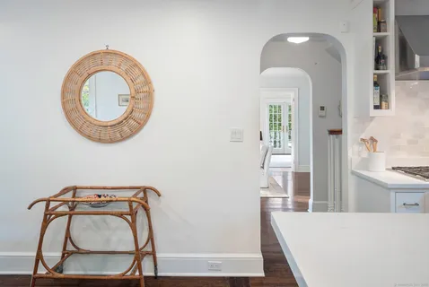 a view of a bedroom with furniture and wooden floor